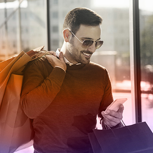 Consumer with shopping bags on their device